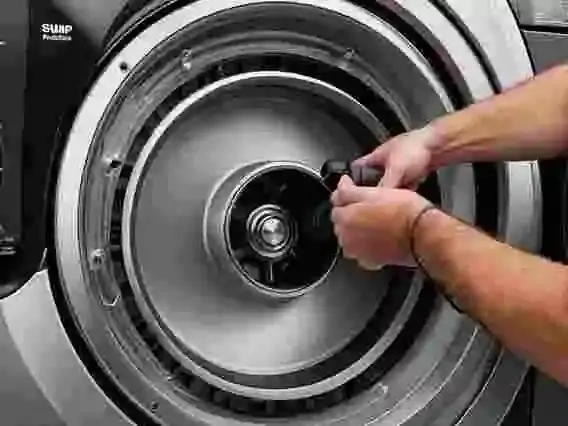 Repairing a washing machine water pump to restore proper drainage function